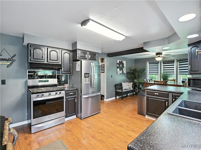 5137 William St, Lancaster, NY 14086 - kitchen with stainless steel appliances, dark countertops, under cabinet range hood, and ceiling fan