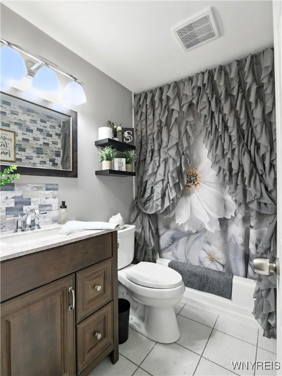 5137 William St, Lancaster, NY 14086 - bathroom featuring vanity, tile patterned flooring, and shower / bath combo
