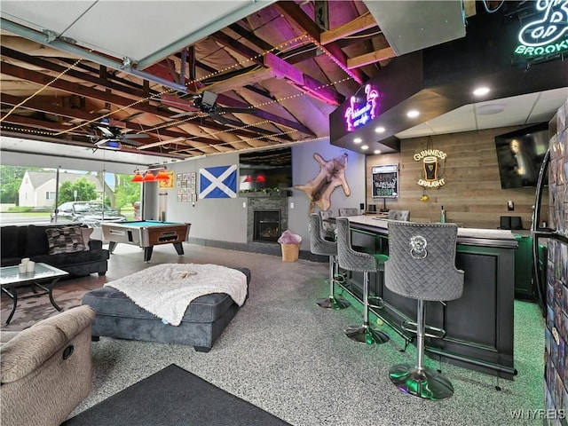 5137 William St, Lancaster, NY 14086 - rec room featuring wet bar, billiards table, wooden walls, a glass covered fireplace, and speckle patterned floor