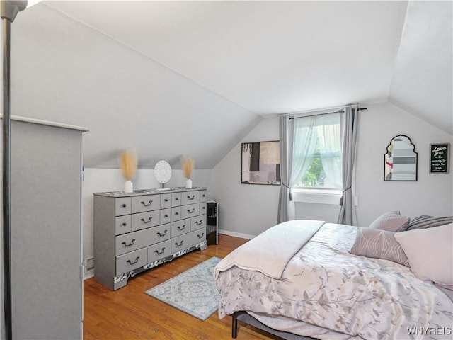 5137 William St, Lancaster, NY 14086 - bedroom featuring wood finished floors and vaulted ceiling