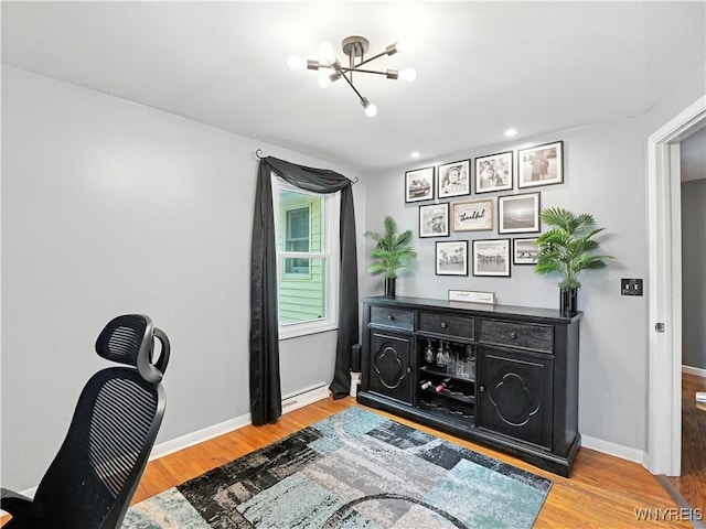 5137 William St, Lancaster, NY 14086 - office space featuring a chandelier, wood finished floors, a baseboard heating unit, and recessed lighting