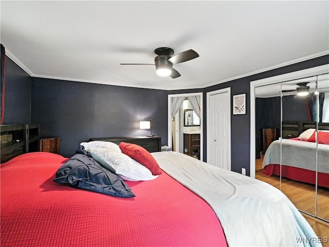 5137 William St, Lancaster, NY 14086 - bedroom with wood finished floors, multiple closets, crown molding, and ceiling fan