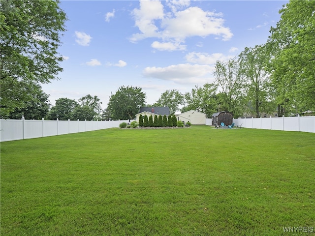 5137 William St, Lancaster, NY 14086 - fenced backyard featuring a storage unit