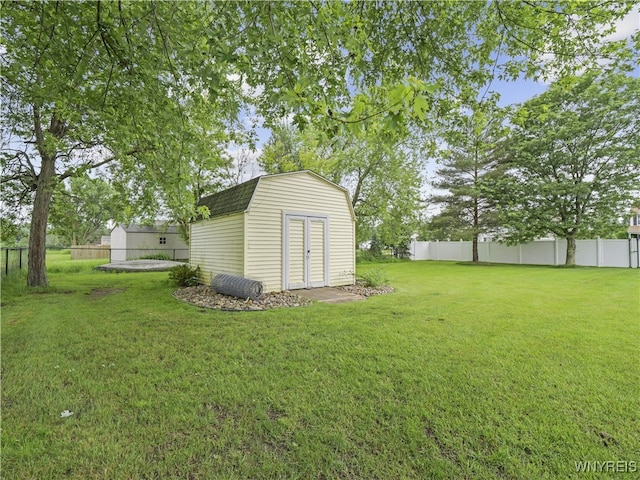 5137 William St, Lancaster, NY 14086 - fenced backyard with a storage unit