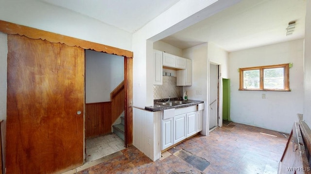 173 Hedley Pl, Buffalo, NY 14208 - kitchen with white cabinets, tasteful backsplash, and dark countertops
