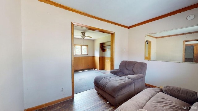 173 Hedley Pl, Buffalo, NY 14208 - living room with wood finished floors, ornamental molding, a ceiling fan, and a wainscoted wall