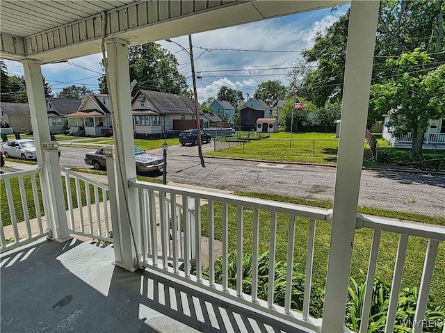221 82nd St, Niagara Falls, NY 14304 - covered porch with a residential view and a lawn