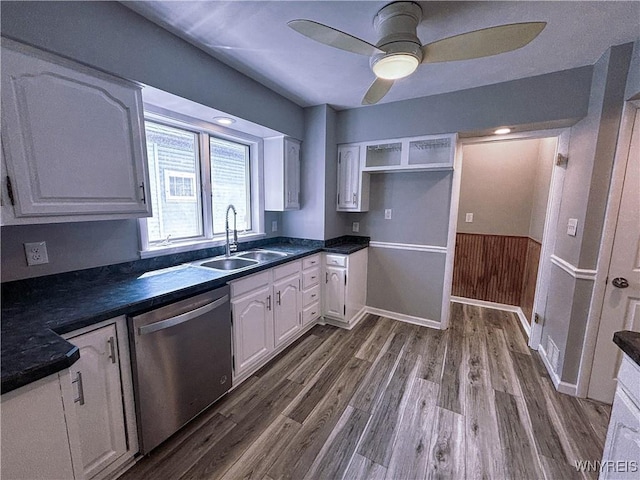 221 82nd St, Niagara Falls, NY 14304 - kitchen with stainless steel dishwasher, dark countertops, and dark wood-style flooring