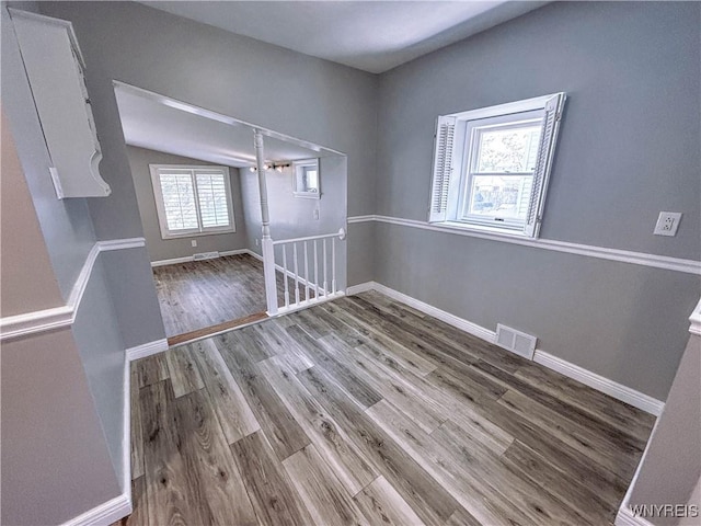 221 82nd St, Niagara Falls, NY 14304 - unfurnished dining area featuring wood finished floors and lofted ceiling