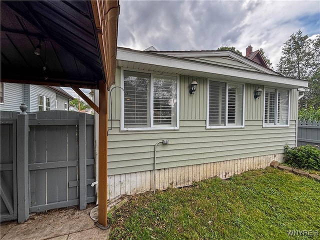 221 82nd St, Niagara Falls, NY 14304 - view of property exterior featuring a chimney