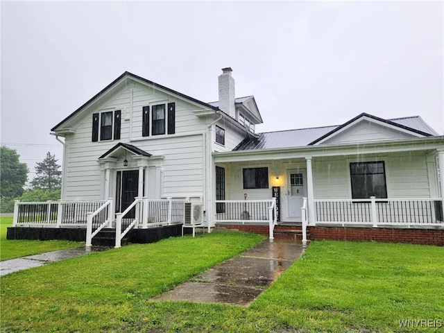 2207 Sheldon Dr, Allegany, NY 14706 - traditional-style home with a chimney, a front lawn, and a porch