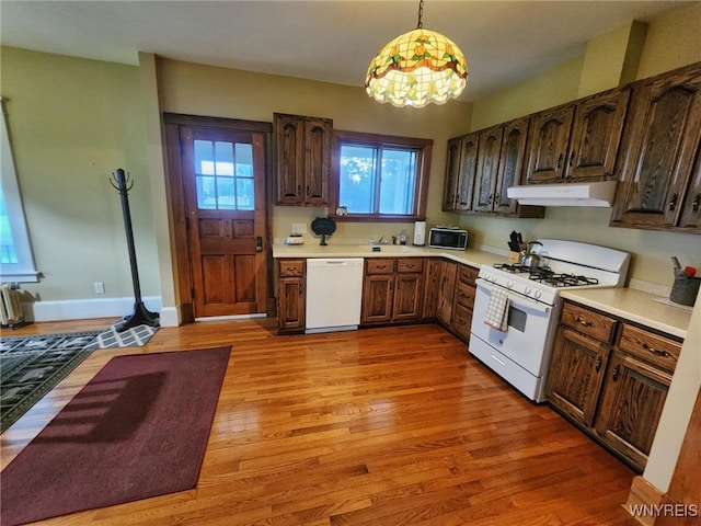 2207 Sheldon Dr, Allegany, NY 14706 - kitchen with white appliances, under cabinet range hood, light countertops, and light wood-type flooring