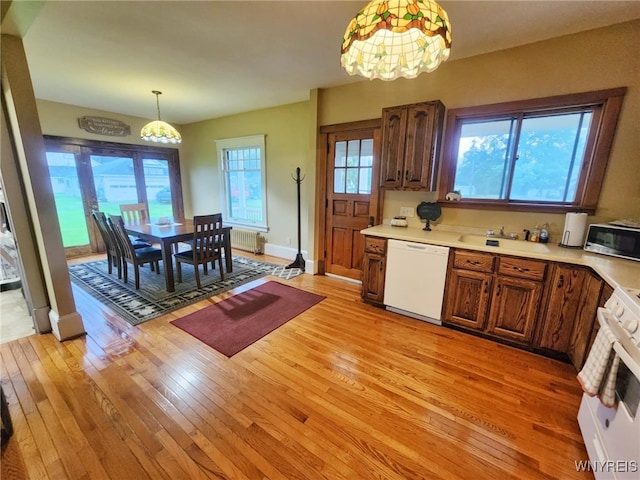 2207 Sheldon Dr, Allegany, NY 14706 - kitchen featuring dishwasher, stainless steel microwave, light wood-style floors, light countertops, and stove
