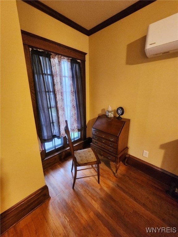 2207 Sheldon Dr, Allegany, NY 14706 - sitting room featuring crown molding, a wall unit AC, and wood finished floors