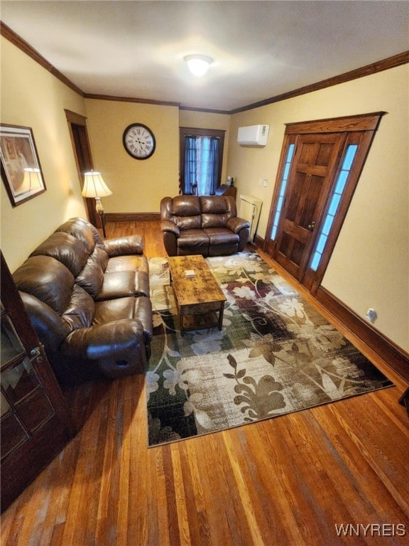2207 Sheldon Dr, Allegany, NY 14706 - living area featuring a wall unit AC, wood finished floors, and ornamental molding