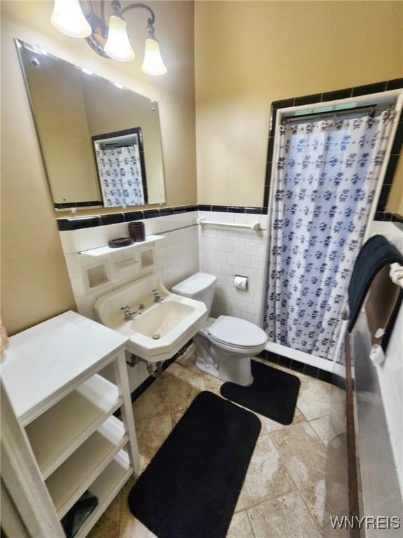 2207 Sheldon Dr, Allegany, NY 14706 - bathroom with curtained shower, tile walls, and wainscoting
