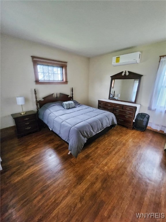 2207 Sheldon Dr, Allegany, NY 14706 - bedroom with an AC wall unit and wood finished floors