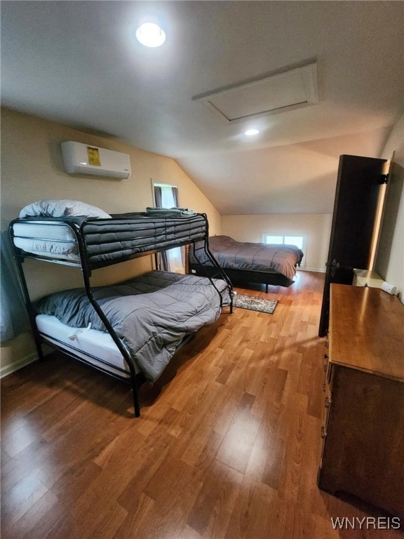 2207 Sheldon Dr, Allegany, NY 14706 - bedroom featuring an AC wall unit, wood finished floors, attic access, vaulted ceiling, and recessed lighting
