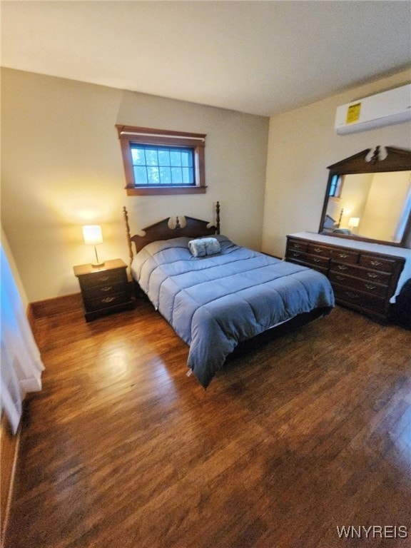 2207 Sheldon Dr, Allegany, NY 14706 - bedroom with a wall mounted air conditioner and wood finished floors