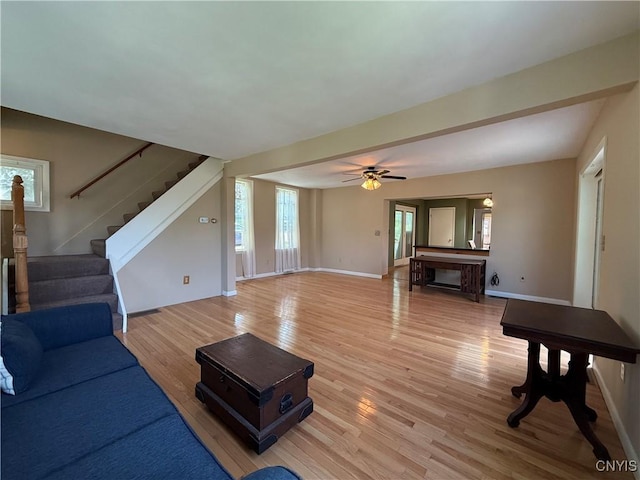 320 W 3rd St, Oswego-City, NY 13126 - unfurnished living room with light wood-style floors, stairway, and a ceiling fan