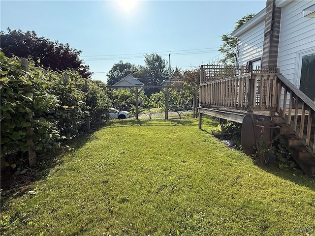 320 W 3rd St, Oswego-City, NY 13126 - view of green lawn with a deck