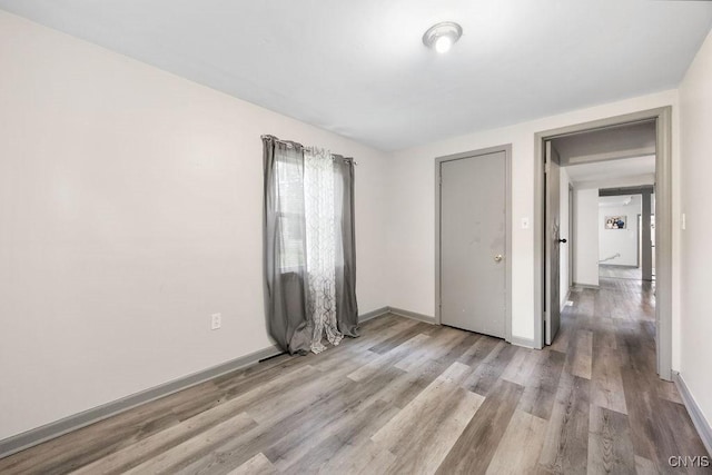 9 Lawrence Ave, New Hartford, NY 13413 - unfurnished bedroom featuring wood finished floors and baseboards
