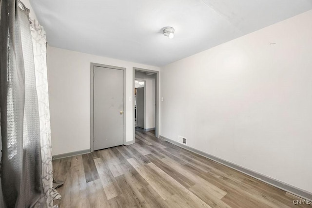 9 Lawrence Ave, New Hartford, NY 13413 - unfurnished bedroom featuring wood finished floors and baseboards