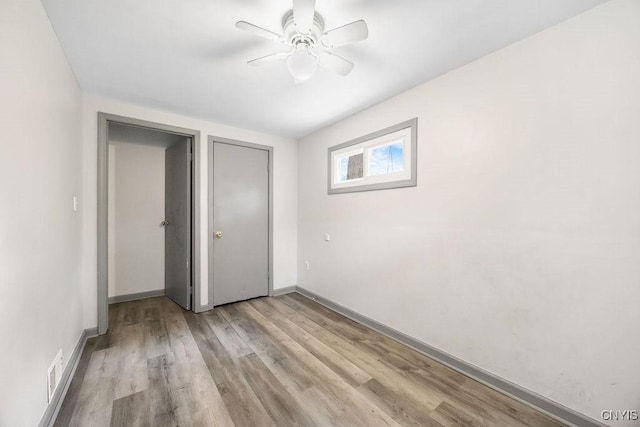 9 Lawrence Ave, New Hartford, NY 13413 - unfurnished bedroom with light wood-type flooring and a ceiling fan