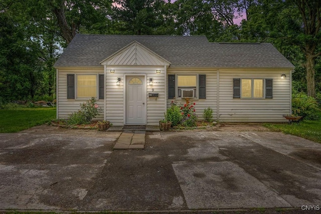 9 Lawrence Ave, New Hartford, NY 13413 - view of front facade with roof with shingles and cooling unit