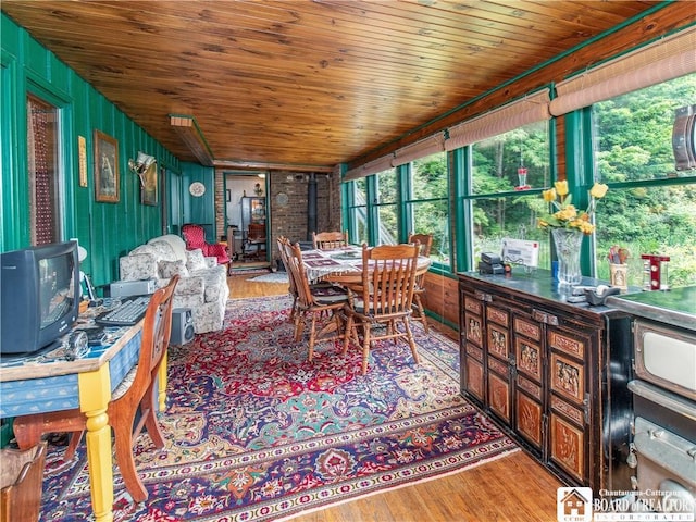 5152 John Darling Rd, Conowingo, NY 14726 - sunroom / solarium featuring a wood stove