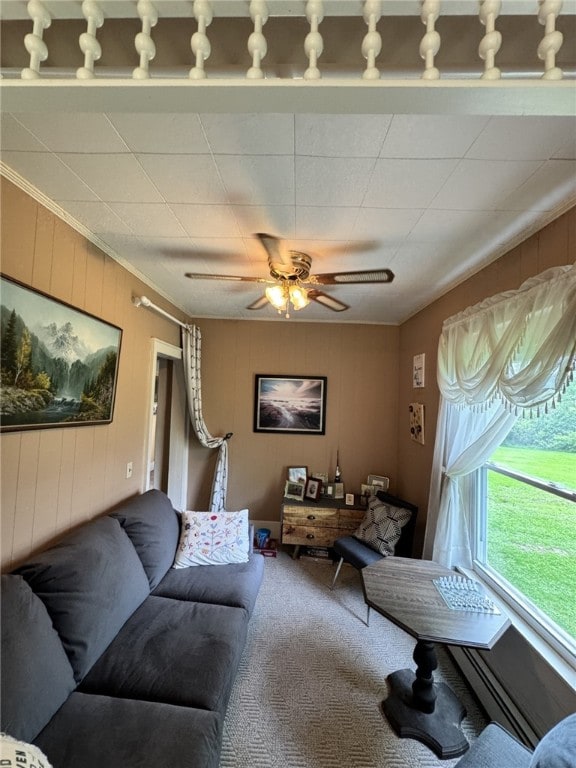 66 W Benton Ave, Port Allegany Boro, PA 16743 - carpeted living room with crown molding, ceiling fan, and wooden walls