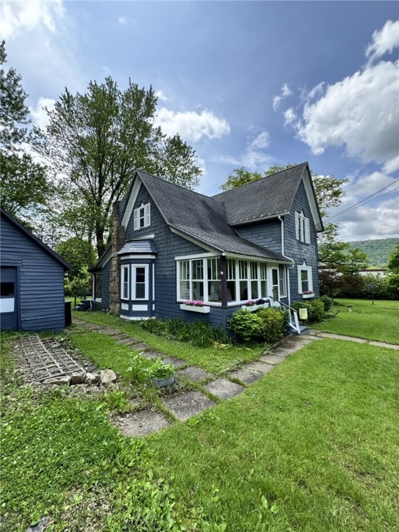 66 W Benton Ave, Port Allegany Boro, PA 16743 - view of property exterior with roof with shingles and a lawn