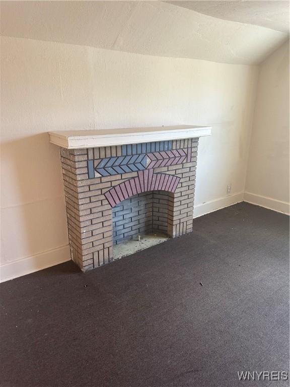 54 Decker St, Buffalo, NY 14215 - detailed view of a brick fireplace and carpet flooring