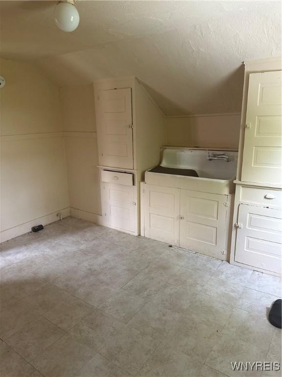 54 Decker St, Buffalo, NY 14215 - additional living space featuring vaulted ceiling