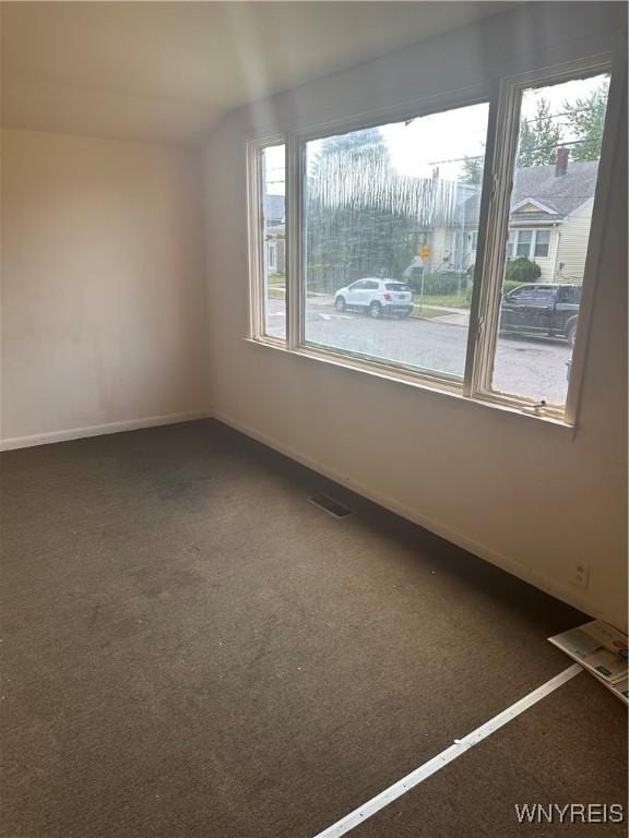 54 Decker St, Buffalo, NY 14215 - carpeted empty room with baseboards