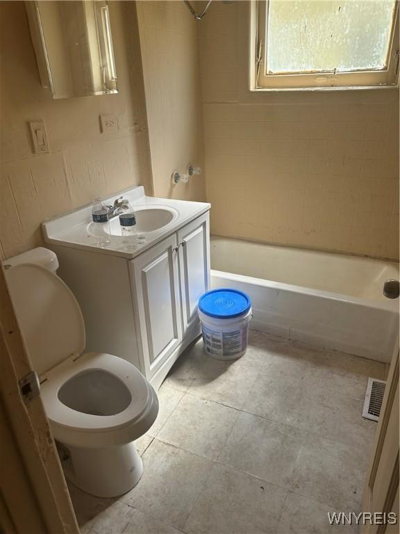 54 Decker St, Buffalo, NY 14215 - bathroom featuring tub / shower combination, vanity, and tile patterned flooring