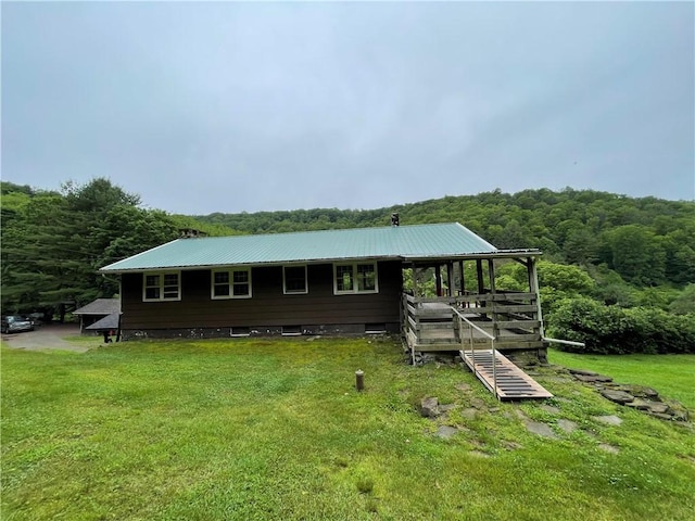 286 Hidden Hollow Farm Dr, Wharton, PA 16720 - rear view of property with a forest view, a lawn, and a metal roof