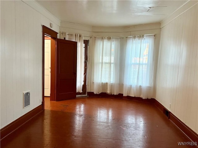 246 Cambridge Ave, Buffalo, NY 14215 - spare room with hardwood / wood-style floors and wooden walls