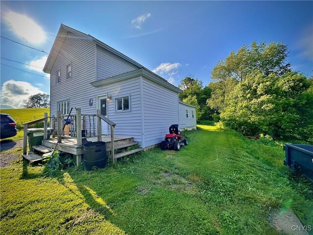 5767 W Main St, West Turin, NY 13325 - view of home's exterior featuring a lawn