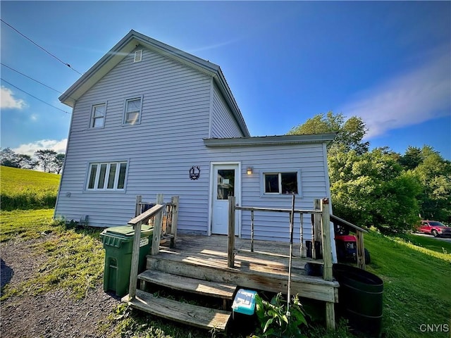 5767 W Main St, West Turin, NY 13325 - back of property with a deck and a lawn