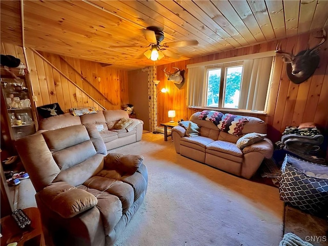 5767 W Main St, West Turin, NY 13325 - carpeted living room with wooden ceiling, wood walls, stairs, and ceiling fan