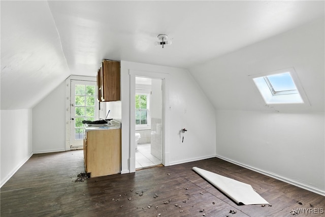 49 Urban St, Buffalo, NY 14211 - additional living space with a skylight, lofted ceiling, and dark wood-type flooring