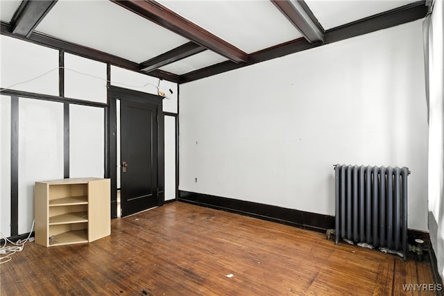 49 Urban St, Buffalo, NY 14211 - empty room featuring radiator heating unit, hardwood / wood-style floors, and beamed ceiling