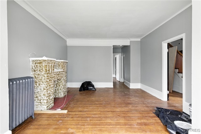 49 Urban St, Buffalo, NY 14211 - unfurnished room with radiator heating unit, ornamental molding, and wood finished floors