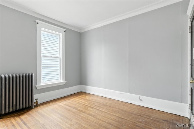 49 Urban St, Buffalo, NY 14211 - spare room with radiator, light wood-style floors, and ornamental molding