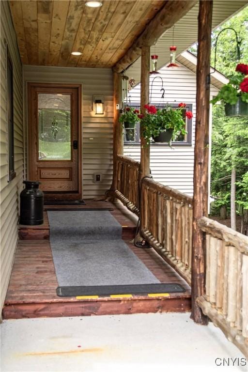 105 Garmon Ave, Webb, NY 13420 - view of exterior entry with a porch