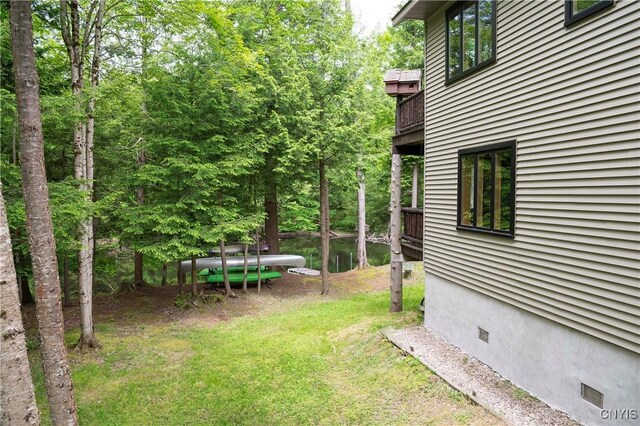 105 Garmon Ave, Webb, NY 13420 - view of grassy yard featuring a balcony
