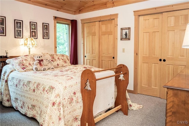 105 Garmon Ave, Webb, NY 13420 - carpeted bedroom with two closets, vaulted ceiling, and wooden ceiling