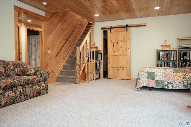105 Garmon Ave, Webb, NY 13420 - carpeted bedroom with recessed lighting, a barn door, wooden ceiling, and wood walls
