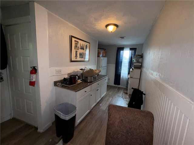 895 S Plymouth Ave, Rochester, NY 14608 - hall featuring wood finished floors and a wainscoted wall